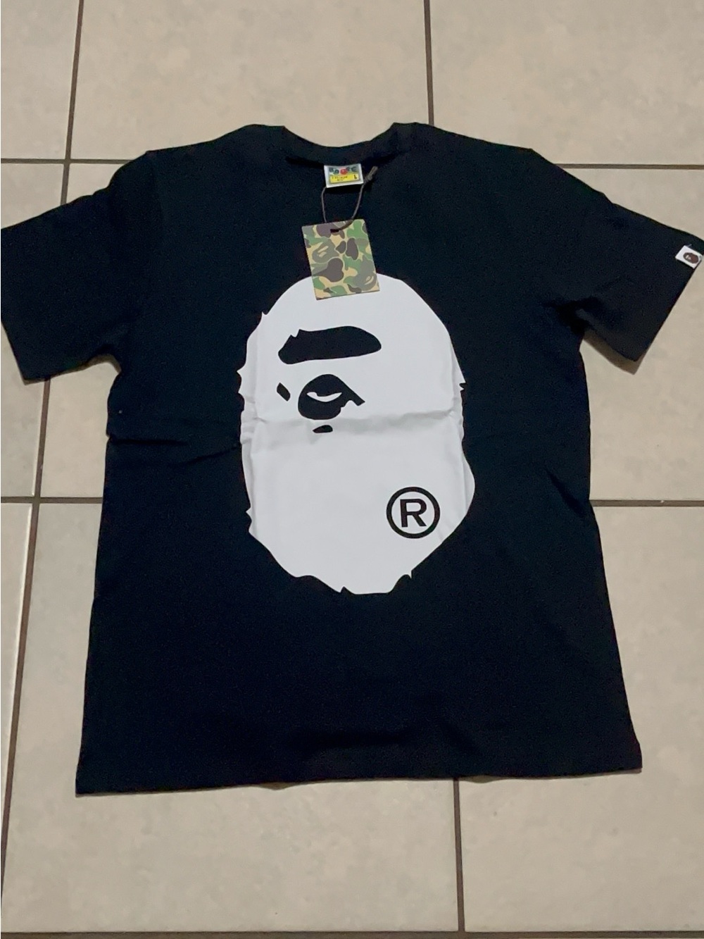A Bathing Ape (BAPE) Black Tee with White Ape Head Graphic